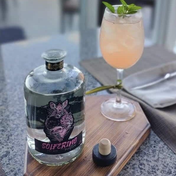 A bottle of Solferino, a Mexican gin, and a gin cocktail